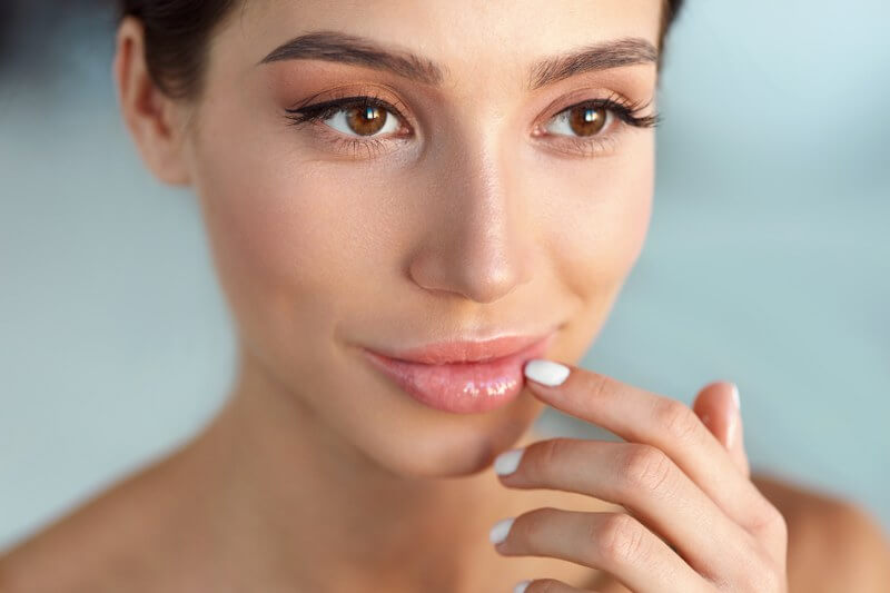 Woman happy with her lips which are natural and not duck lips