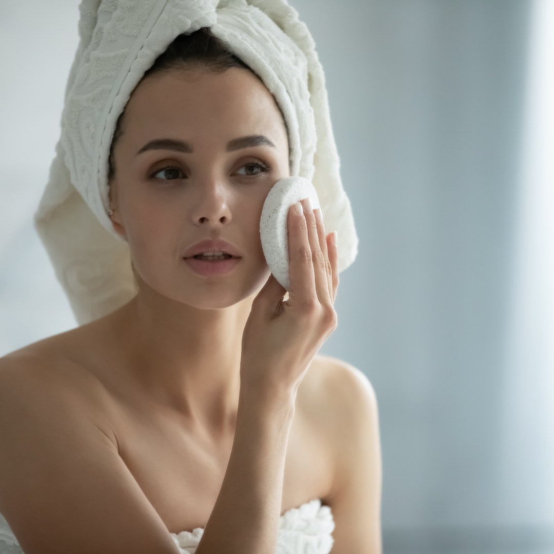 Woman in bathroom enjoying a professional facial at home