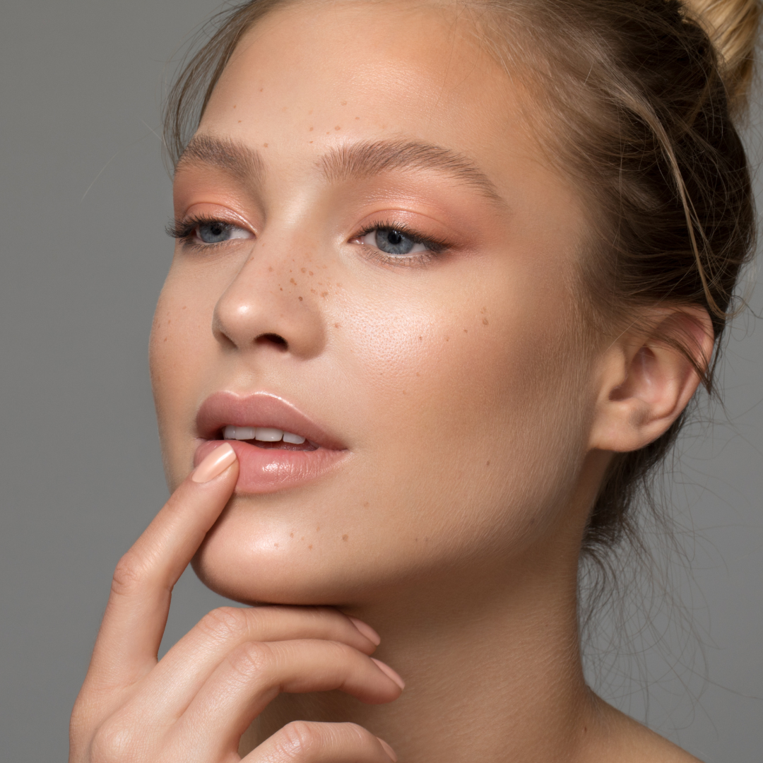 beautiful model contemplating 7 ways to make your face look younger