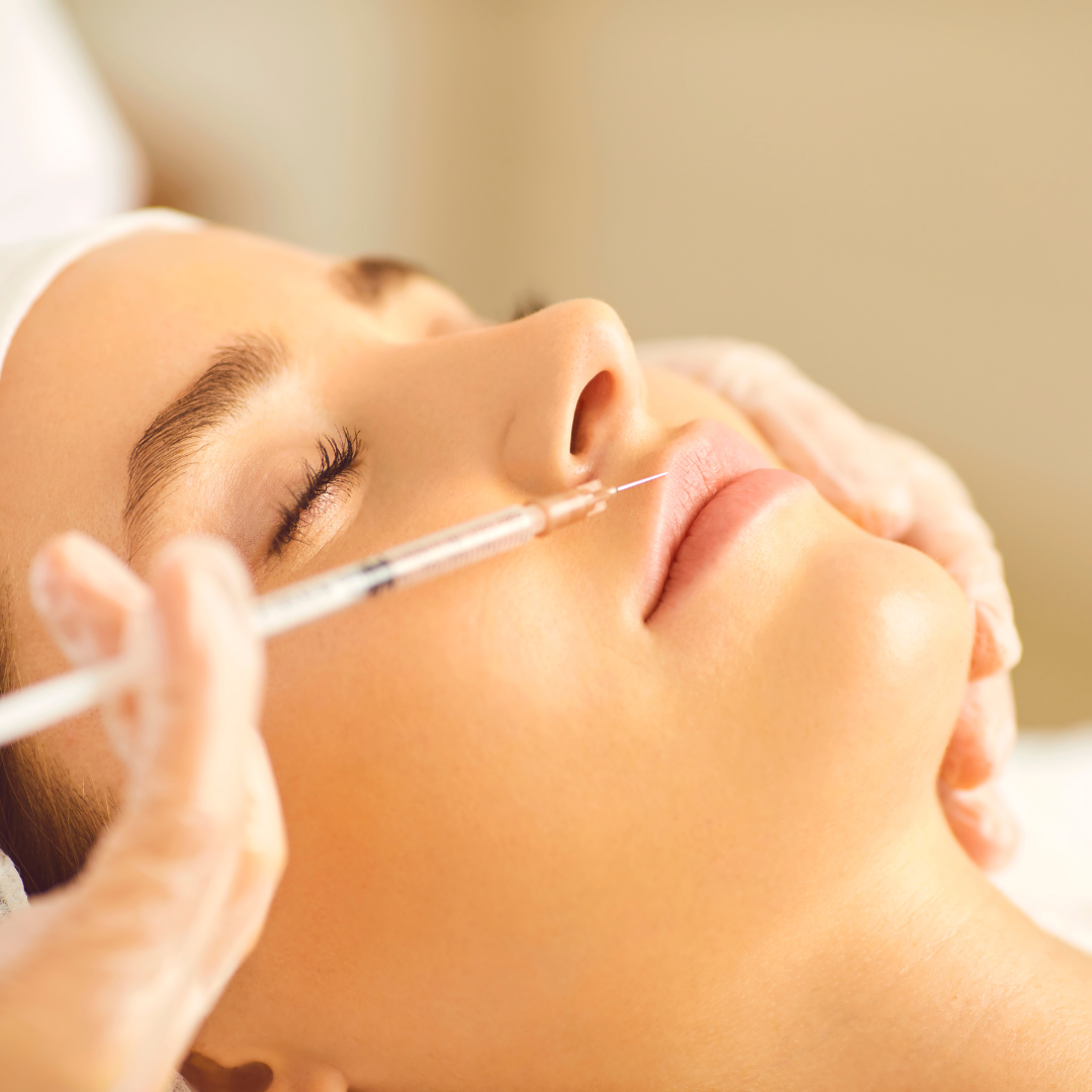 Woman having a quality lip filler treatment, avoiding cheap lip fillers to protect her health and safety.