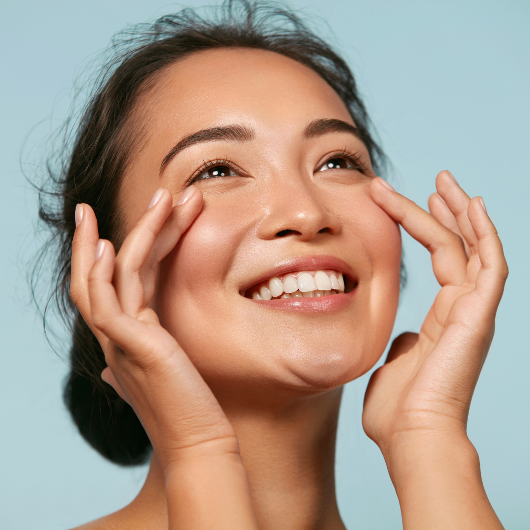 Woman smiling and feeling confident after her summer skin treatments