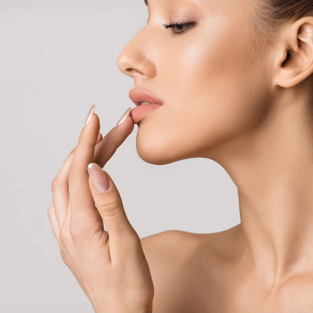 Woman with perfect lip filler following these aftercare tips