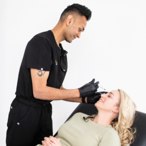 Award-winning aesthetics practitioner Amish Patel giving a client anti-wrinkle injections, often referred to as Botox in Gravesend, Kent 